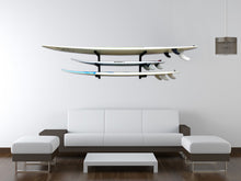 Load image into Gallery viewer, Wall mounted surfboard racks in house powder coated black to hold 3 surfboards 