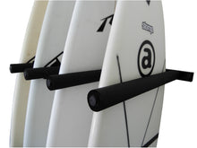 Load image into Gallery viewer, Wall mounted vertical surfboard racks powder coated black to hold 4 boards